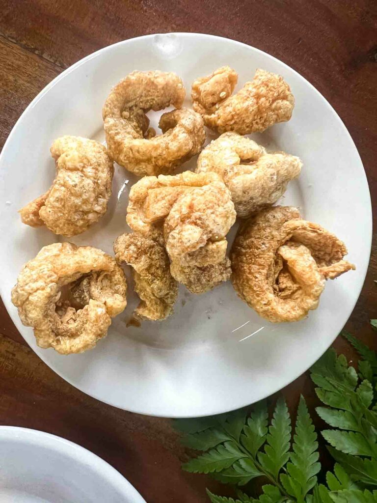 Chicharron, fried pork skin on a white plate a famous food of Carcar south Cebu