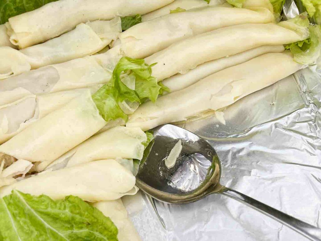 South Cebu food called fresh lumpia with a spoon in a metal serving bowl