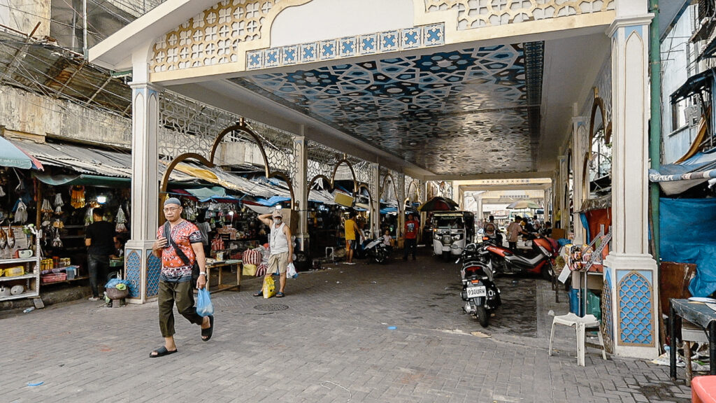 Manila Muslim Town Gate in Quiapo with vendors underneath