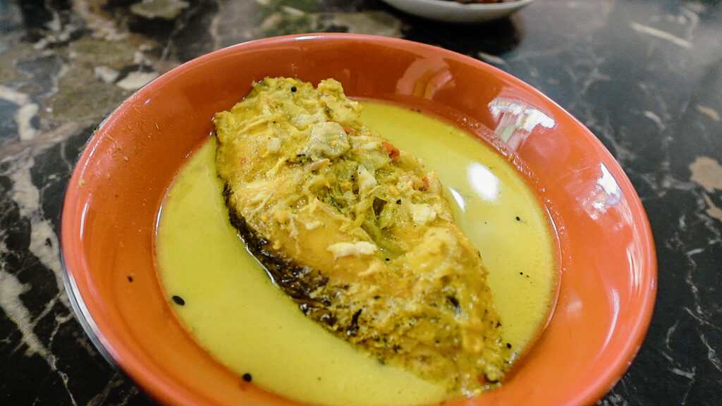 Muslim Food in Philippines FIsh Curry on table at restaurant in Quiapo Manila