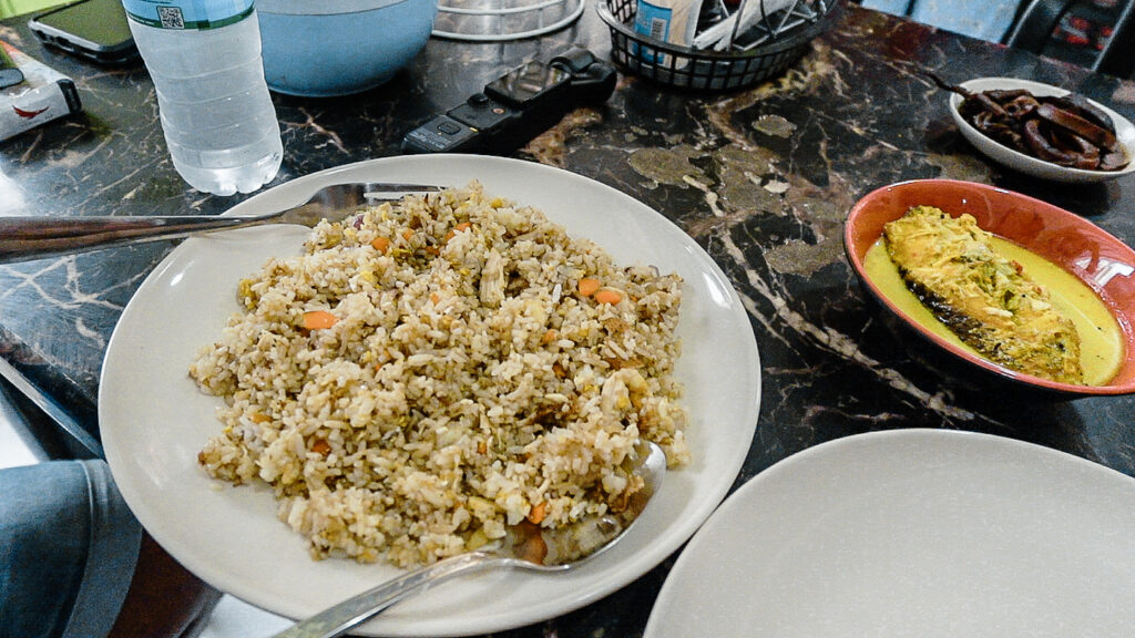 Fried rice and fish curry on table at a Muslim food restaurant in Quiapo