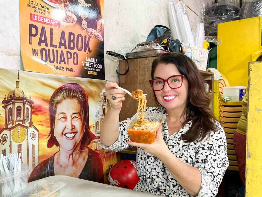 Eating one of the most popular foods in Manila, palabok