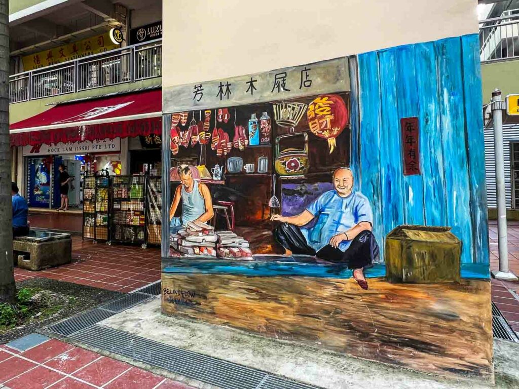 Singapore Chinatown street art featuring traditional shop with locals