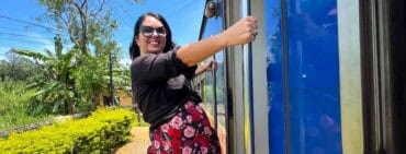 Woman outside posing on Ella Odyssey train