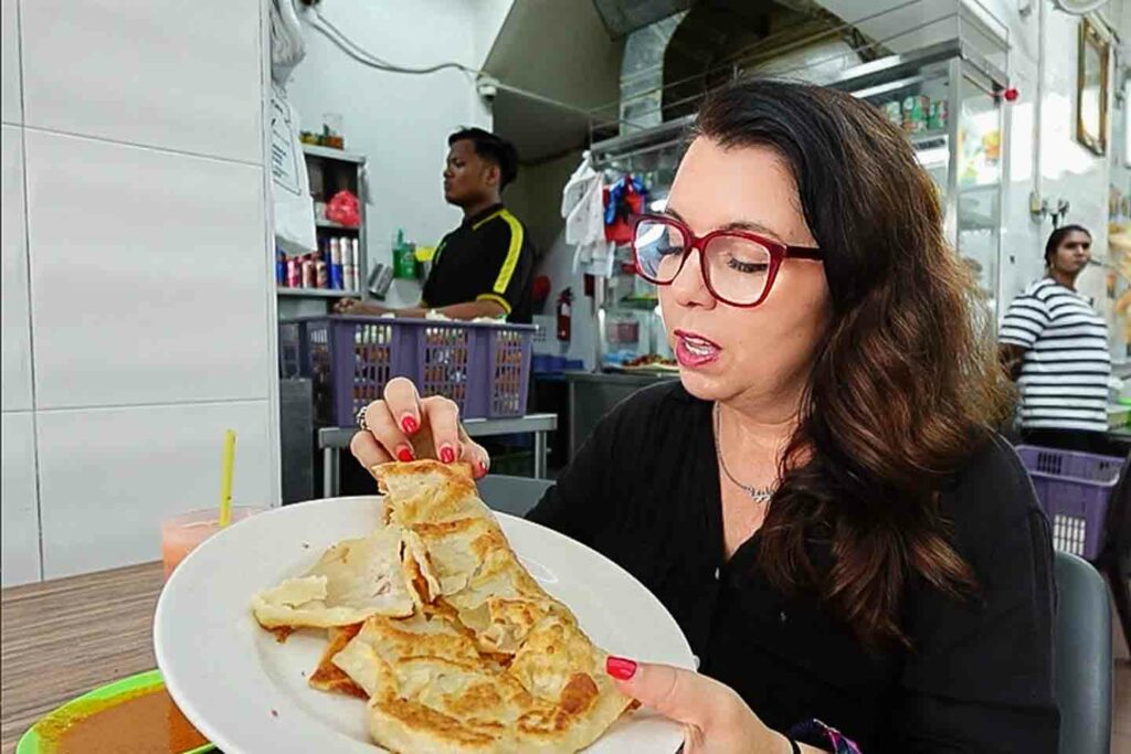 Ayngelina eating prata Singapore breakfast at local restaurant