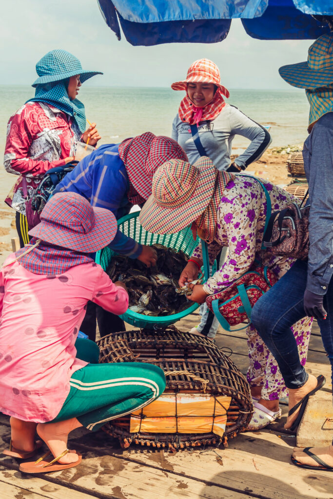 Khmer women checking blue crab at Kep seafood market